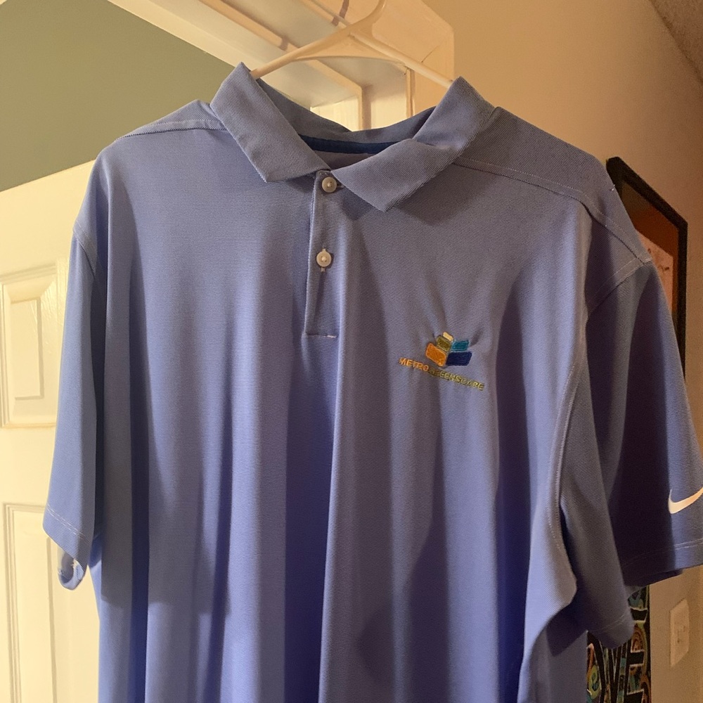 Nike DriFit Polo. XL blue in color
